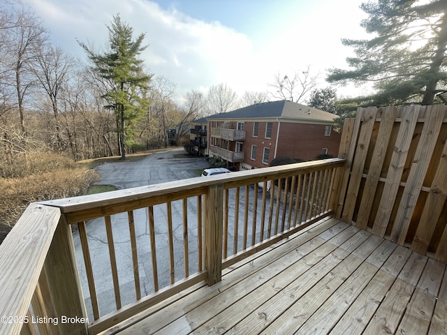 wooden deck featuring driveway