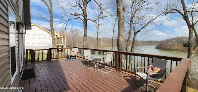 wooden deck featuring a water view