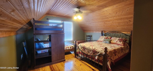 bedroom with wood-type flooring, wood ceiling, a ceiling fan, and vaulted ceiling