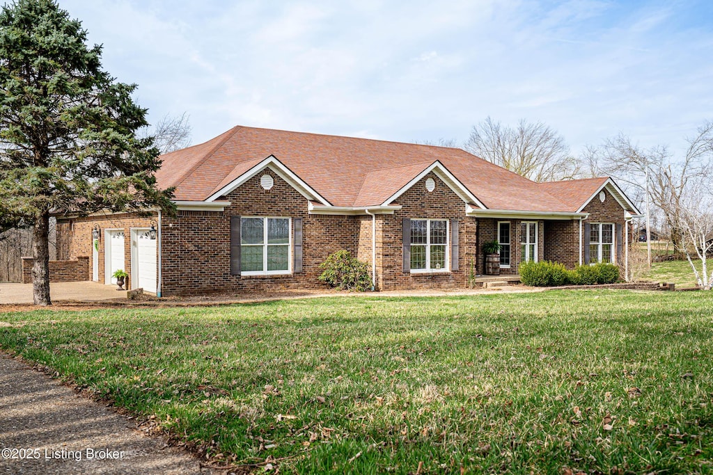 4150 Franklin Rd, Bloomfield, KY 40008 - ranch-style home featuring a front yard, driveway, an attached garage, a shingled roof, and brick siding