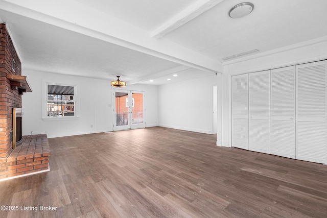 unfurnished living room featuring beamed ceiling, wood finished floors, recessed lighting, a fireplace, and baseboards