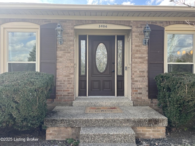 entrance to property with brick siding