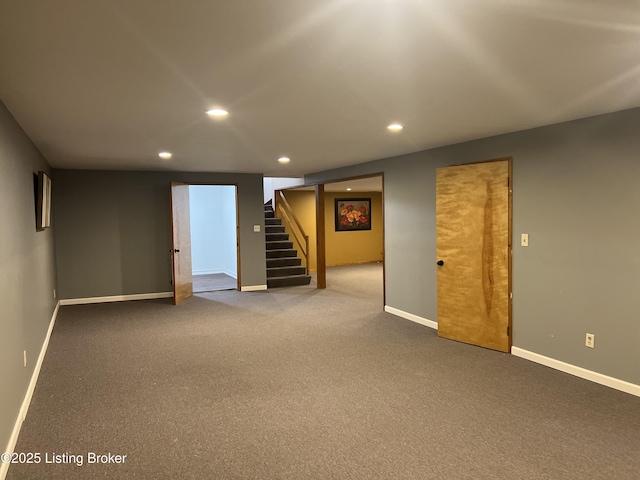 finished below grade area featuring recessed lighting, carpet flooring, baseboards, and stairs