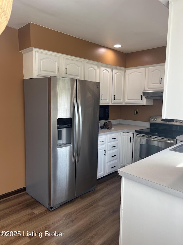 kitchen featuring under cabinet range hood, dark wood-style floors, white cabinets, and appliances with stainless steel finishes