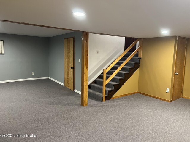 finished below grade area with recessed lighting, stairway, carpet flooring, and baseboards