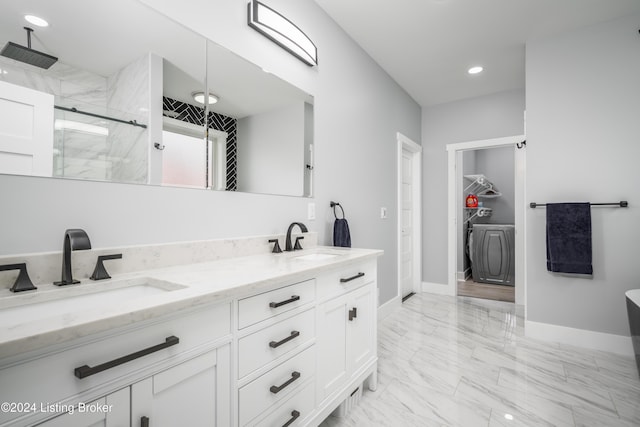 bathroom featuring recessed lighting, a stall shower, marble finish floor, and a sink