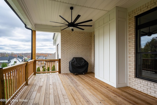 deck with a ceiling fan and grilling area