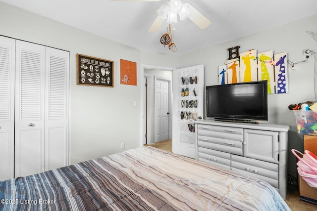 bedroom with a ceiling fan and a closet