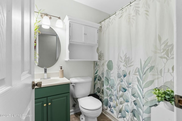 bathroom with baseboards, toilet, vanity, and a shower with curtain