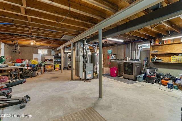 unfinished basement with heating unit, washing machine and dryer, and water heater