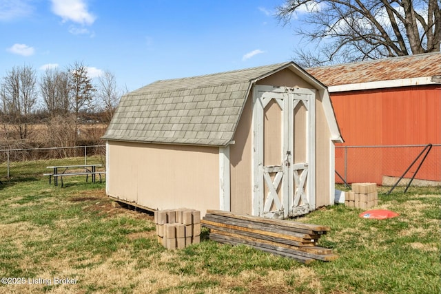 view of shed with fence