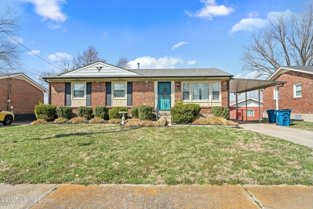 ranch-style home with an attached carport, concrete driveway, brick siding, and a front lawn