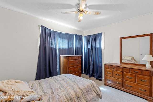 bedroom with light colored carpet and ceiling fan