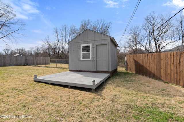 view of shed with a fenced backyard