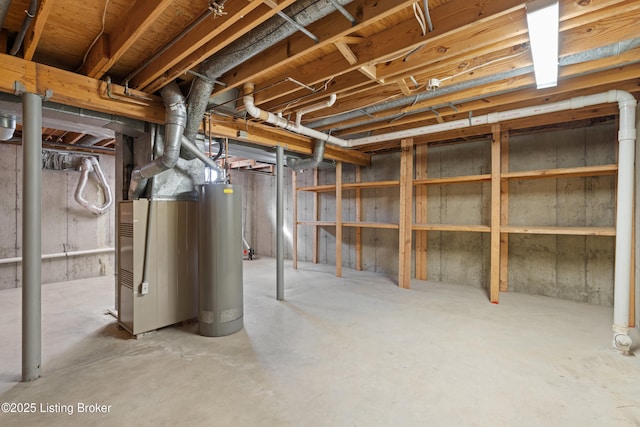 unfinished basement with gas water heater and heating unit