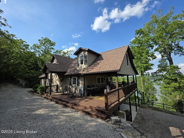 260 Patriots Path Ln, Falls Of Rough, KY 40119 - view of front of house with a deck, fence, and roof with shingles