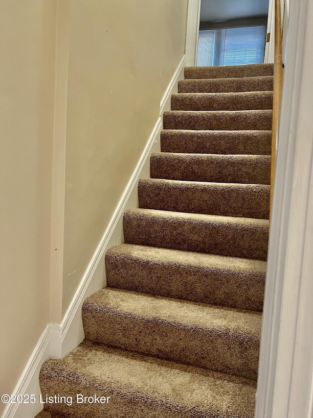 stairway with baseboards