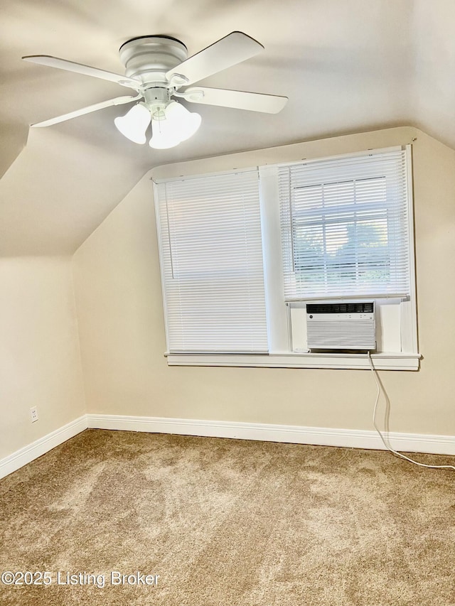 bonus room with vaulted ceiling, carpet, baseboards, and ceiling fan