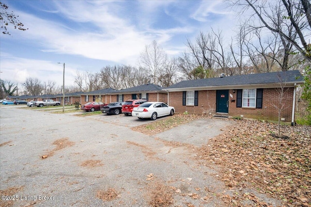 view of front of house featuring brick siding