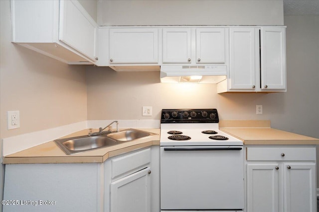 kitchen with under cabinet range hood, electric range, white cabinetry, and a sink