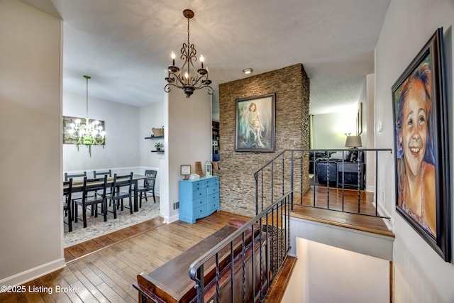 3140 Yorkshire Dr, Bardstown, KY 40004 - staircase with an inviting chandelier, hardwood / wood-style flooring, and baseboards