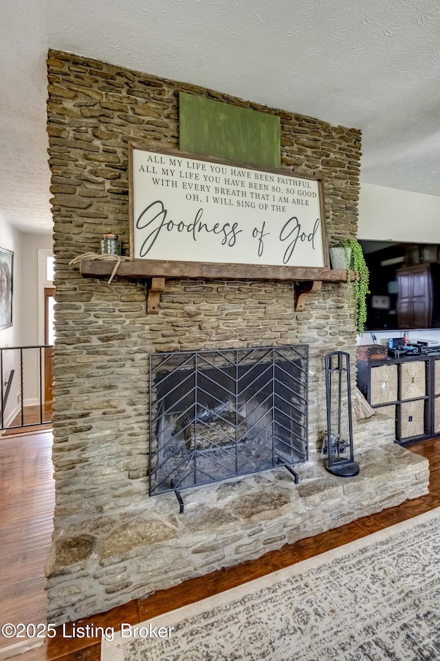 3140 Yorkshire Dr, Bardstown, KY 40004 - room details with a textured ceiling, a large fireplace, and wood finished floors