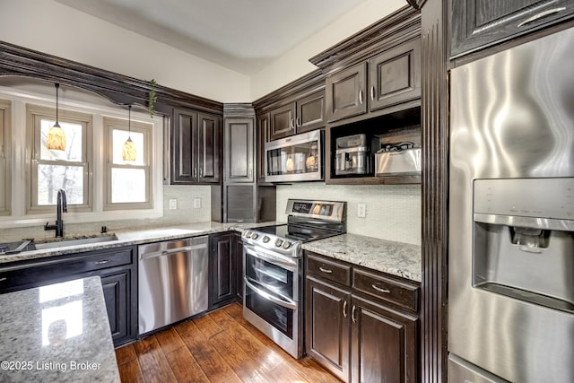 3140 Yorkshire Dr, Bardstown, KY 40004 - kitchen with dark brown cabinets, dark wood finished floors, a sink, and stainless steel appliances