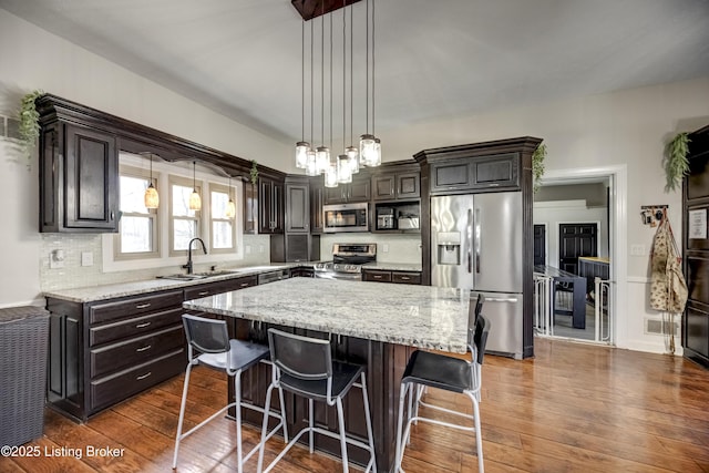 3140 Yorkshire Dr, Bardstown, KY 40004 - kitchen with a sink, stainless steel appliances, dark wood-type flooring, and decorative backsplash