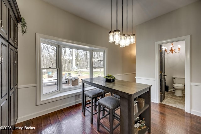 3140 Yorkshire Dr, Bardstown, KY 40004 - dining room with dark wood-style floors, baseboards, and an inviting chandelier