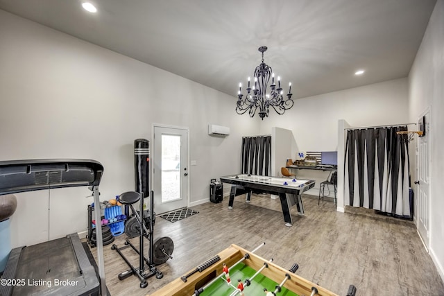 3140 Yorkshire Dr, Bardstown, KY 40004 - recreation room with a wall mounted air conditioner, a chandelier, baseboards, wood finished floors, and recessed lighting