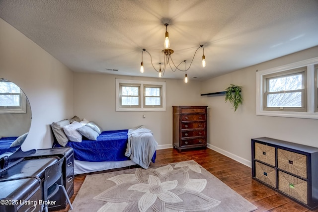 3140 Yorkshire Dr, Bardstown, KY 40004 - bedroom featuring visible vents, a textured ceiling, baseboards, and wood finished floors