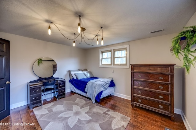3140 Yorkshire Dr, Bardstown, KY 40004 - bedroom featuring dark wood finished floors, a notable chandelier, baseboards, and visible vents