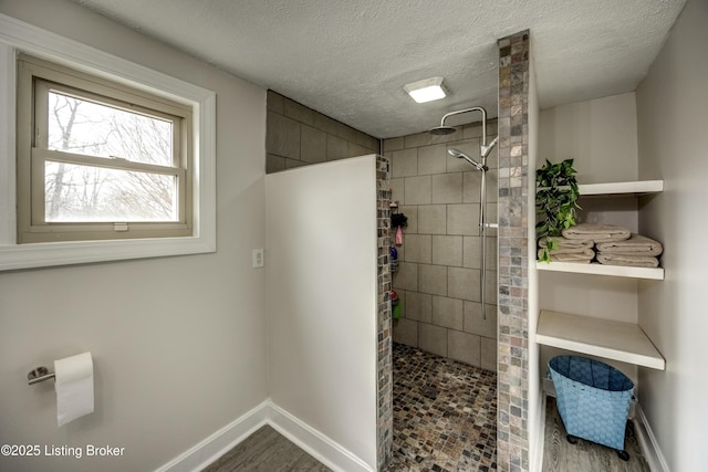 3140 Yorkshire Dr, Bardstown, KY 40004 - full bath featuring a textured ceiling, baseboards, wood finished floors, and walk in shower
