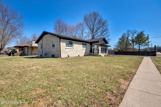 view of property exterior featuring stone siding and a lawn