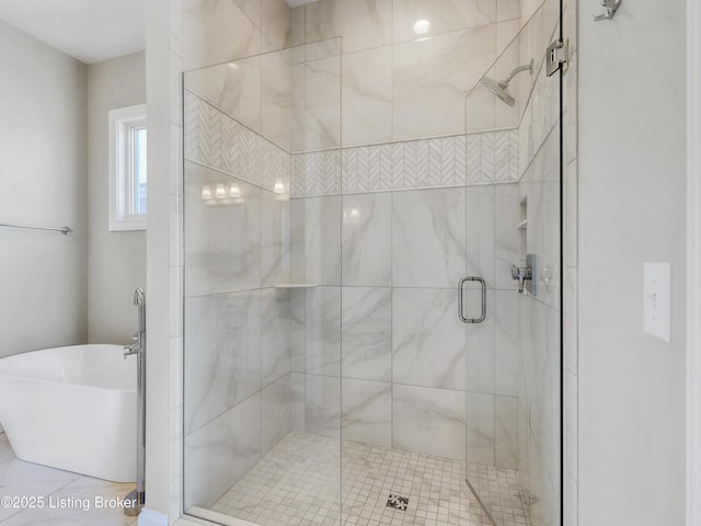 full bathroom with a soaking tub and a stall shower