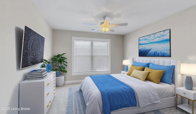 carpeted bedroom with a ceiling fan and baseboards