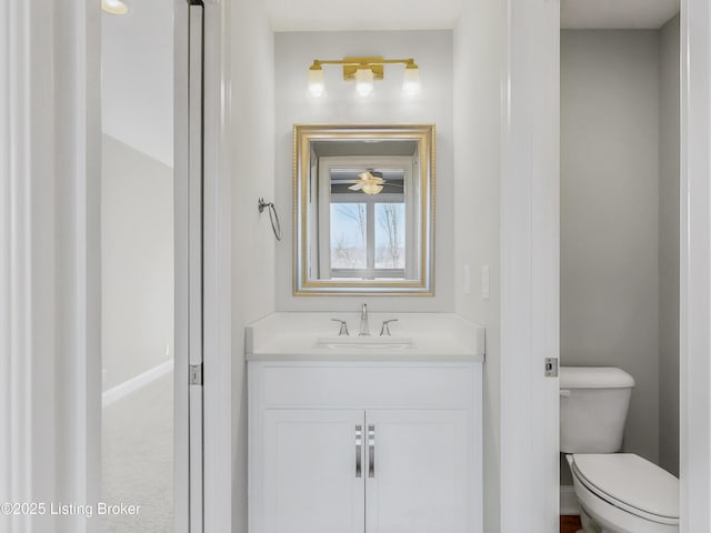 bathroom with vanity and toilet