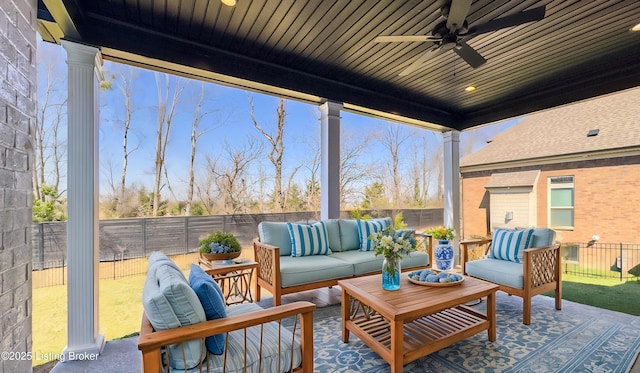 view of patio featuring a ceiling fan, an outdoor living space, and a fenced backyard