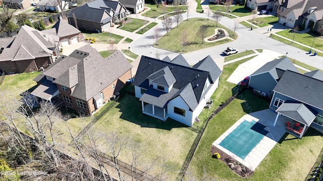 birds eye view of property with a residential view