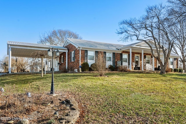 268 Cobb Rd, Eminence, KY 40019 - view of front of house with covered porch, brick siding, metal roof, and a front lawn