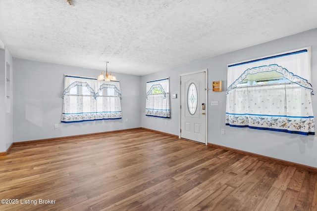 268 Cobb Rd, Eminence, KY 40019 - entrance foyer featuring a chandelier, hardwood / wood-style flooring, a textured ceiling, and baseboards