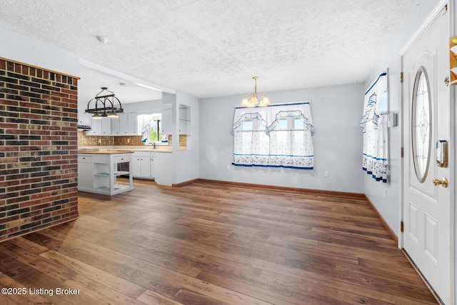 268 Cobb Rd, Eminence, KY 40019 - interior space with a textured ceiling, hardwood / wood-style floors, and a notable chandelier
