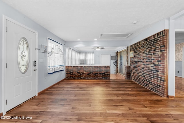 268 Cobb Rd, Eminence, KY 40019 - foyer featuring baseboards, brick wall, and wood finished floors
