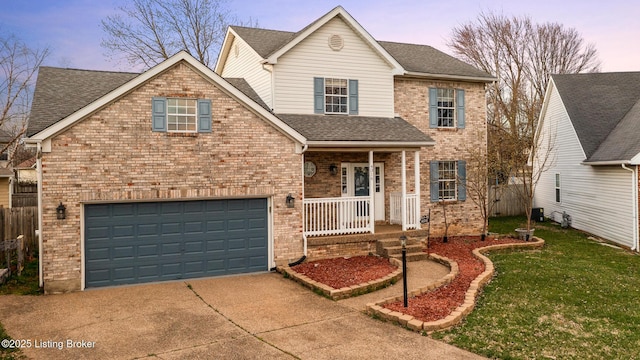 4316 Arwine Ct, Louisville, KY 40245 - traditional-style house featuring a porch, a shingled roof, concrete driveway, a front lawn, and brick siding