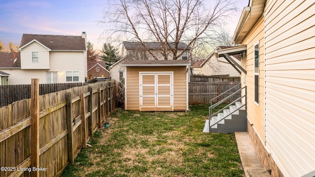 4316 Arwine Ct, Louisville, KY 40245 - view of yard with an outbuilding, a storage unit, and a fenced backyard