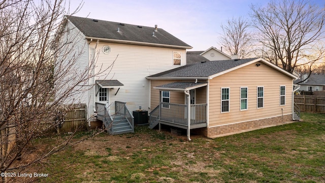 4316 Arwine Ct, Louisville, KY 40245 - back of property with fence, roof with shingles, a wooden deck, central AC, and a lawn