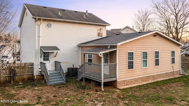 4316 Arwine Ct, Louisville, KY 40245 - rear view of house featuring a deck, fence, central AC, and roof with shingles