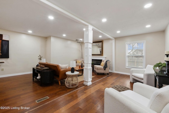 4316 Arwine Ct, Louisville, KY 40245 - living area featuring a glass covered fireplace, dark wood-type flooring, recessed lighting, and visible vents