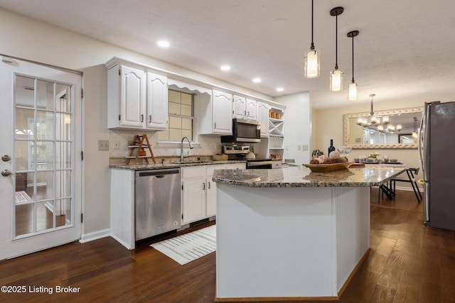 4316 Arwine Ct, Louisville, KY 40245 - kitchen featuring tasteful backsplash, appliances with stainless steel finishes, dark wood finished floors, and white cabinetry
