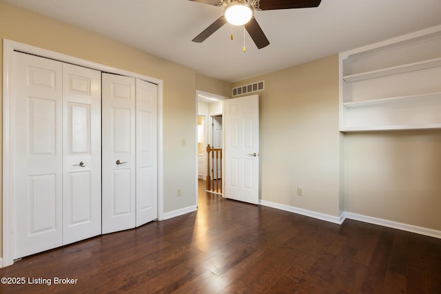 4316 Arwine Ct, Louisville, KY 40245 - unfurnished bedroom with visible vents, dark wood-type flooring, a ceiling fan, a closet, and baseboards